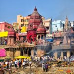 Lively view of the Ghats along the Ganges River in Varanasi, India.